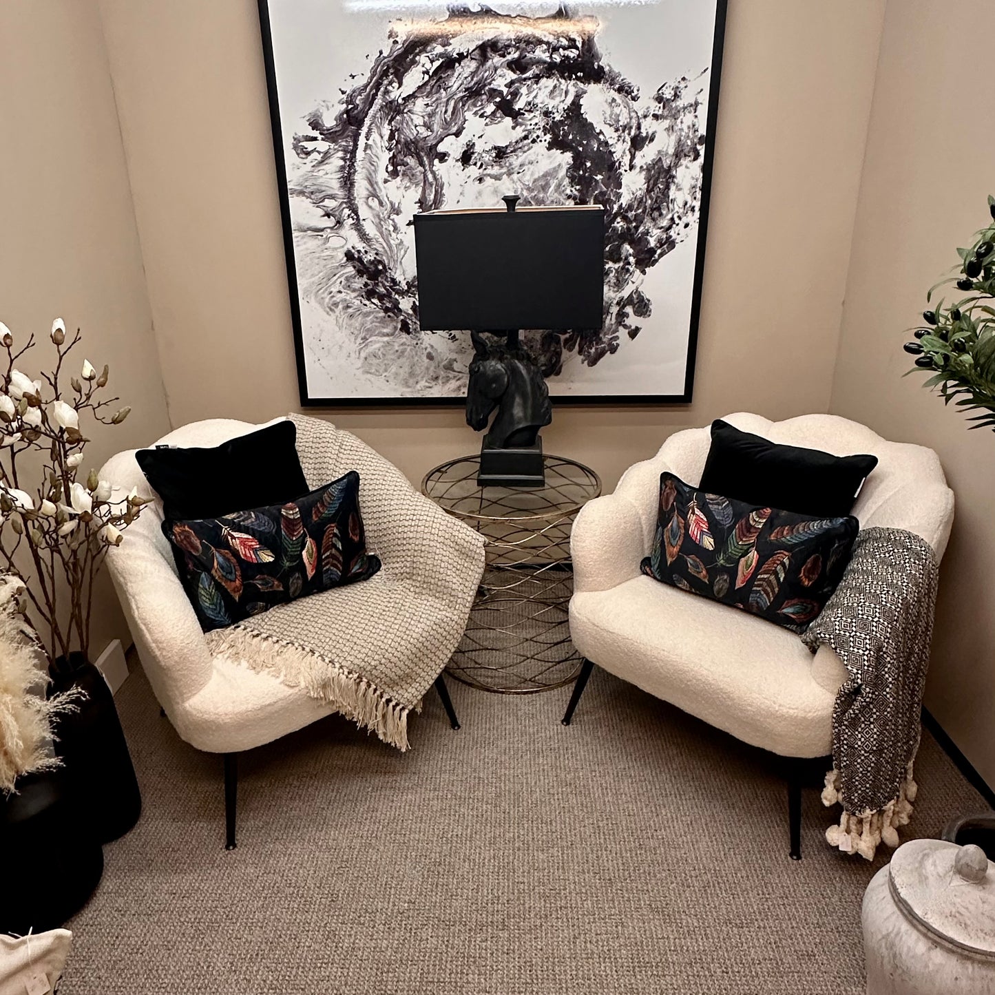 albury-house-interiors-boucle-chairs-black-feather-cushions-monochrome-setting