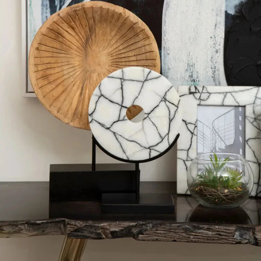 black-and-white-veined-marble-disc-on-matt-black-stand-at-albury-house-interiors