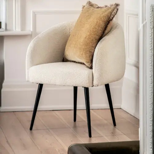 ivory-boucle-tub-chair-with-black-legs-in-living-room-albury-house-interiors