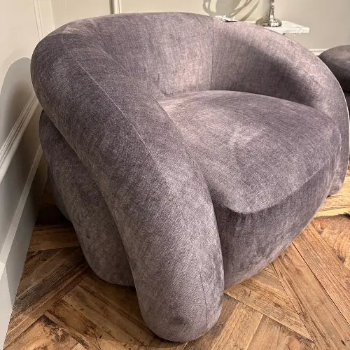 Bruges oversized curved bubble armchair, upholstered in grey velvet. Available to purchase from Albury House Interiors in both grey and ivory.