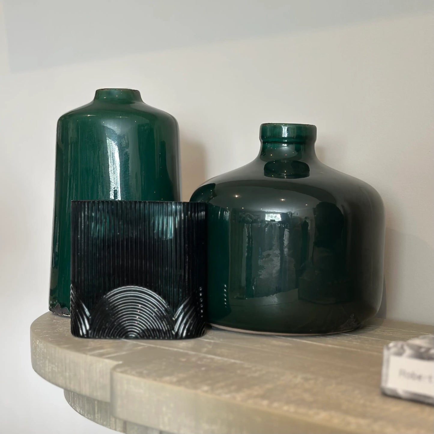emerald-green-ceramic-bottle-vase-and-wide-chive-vase-with-small-opening-paired-with-green-glss-arches-ribbed-vase-at-albury-house-interiors