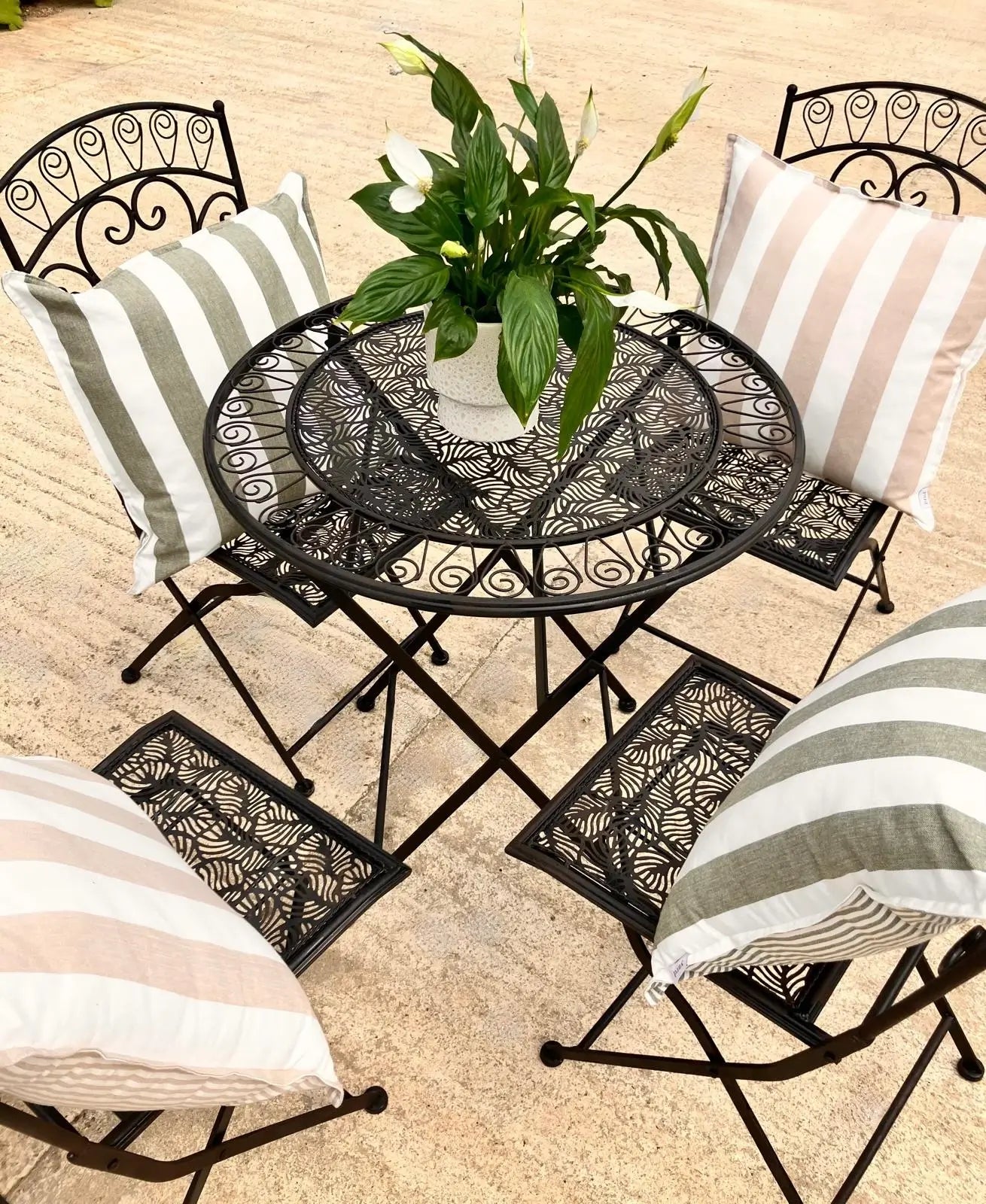 esher-thick-and-thin-stripe-reversible-sof-outdoor-cushions-in-natural-beige-and-white-and-green-and-white-on-bistro-set-at-albury-house-interiors