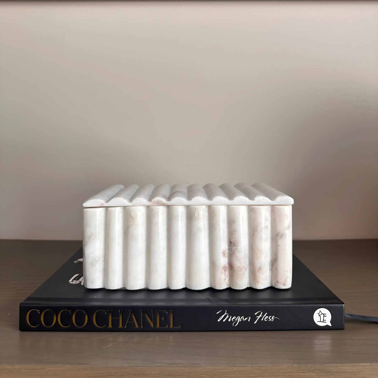 fluted-natural-white-marble-trinket-box-in-large-size-on-top-of-coco-chanel-hardbak-coffee-table-book-at-albury-house-interiors-essex