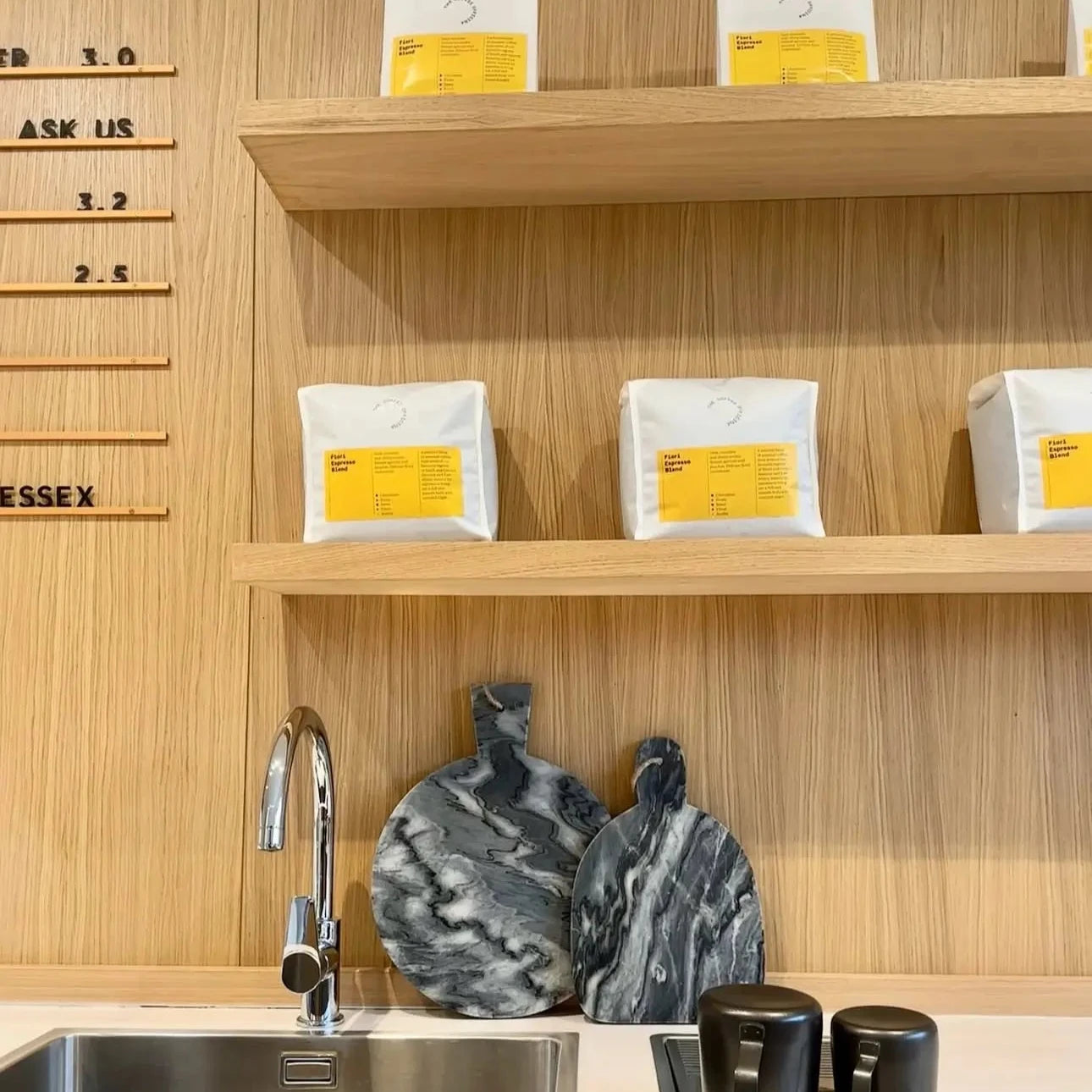 light-grey-amd-dark-grey-natural-marble-stone-paddle-chopping-serving-board-with-string-for-hanging-at-albury-house-interiors-and-coffee-shop-essex