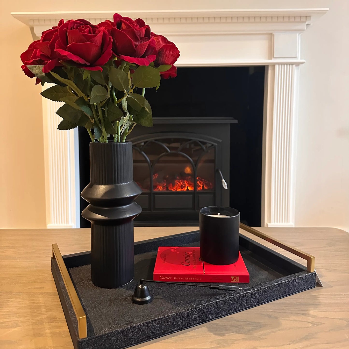 harpa-black-ribbed-vase-withblack-shagreen-coffee-table-tray-and-red-cartier-coffee-table-book-at-albury-house-interiors