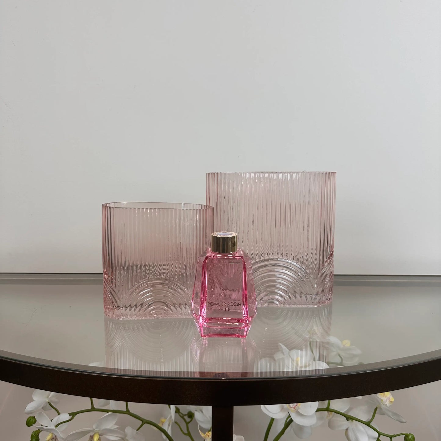 pink-glass-arches-ribbed-vases-in-sizes-small-and-large-with-pink-powder-room-reed-diffuser-at-albury-house-interiors-showroom-and-coffeeshop-matching-tye-essex