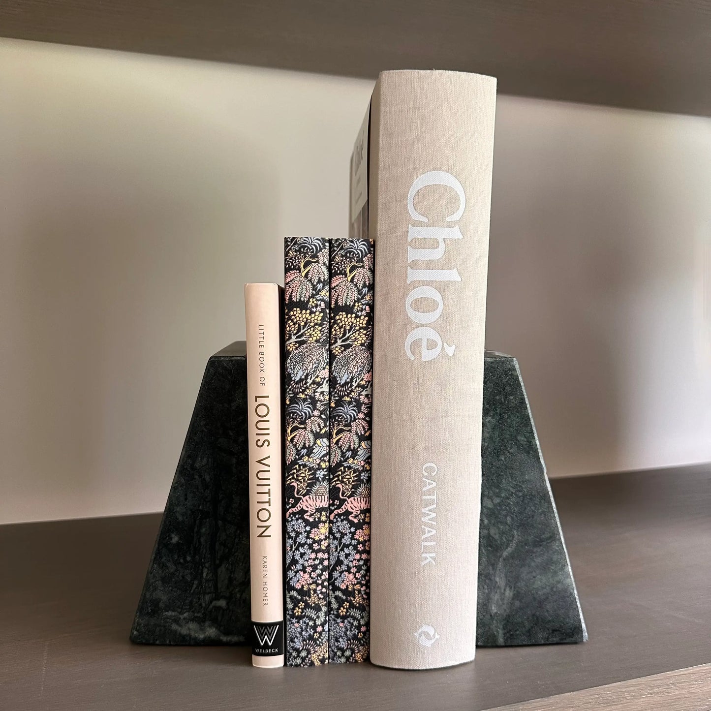 little-book-of-louis-vuitton-and-chloe-catwalk-book-with-black-marble-bookends-at-albury-house-interiors-essex