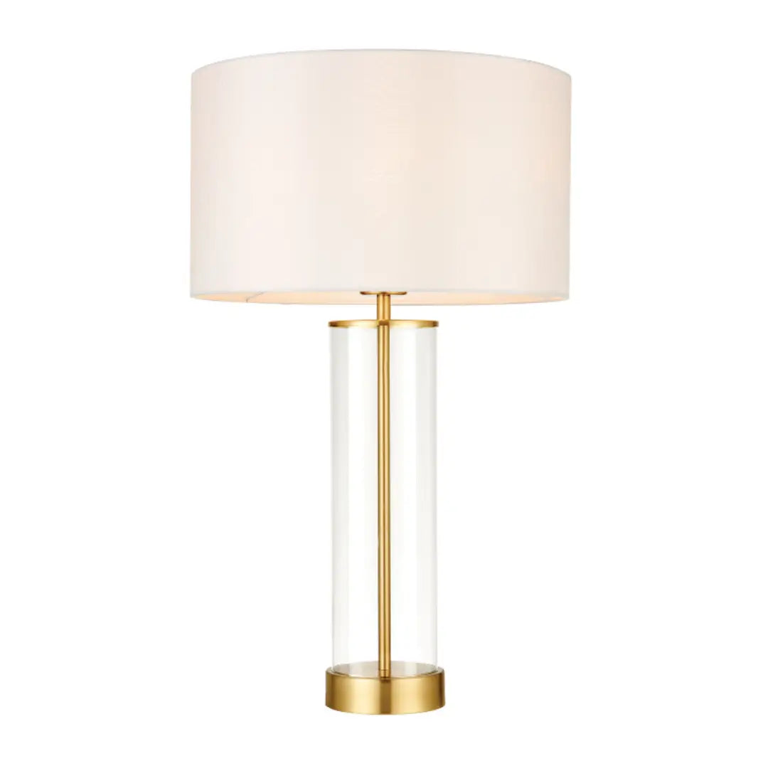 Louvre glass cylinder table lamp with brushed gold accents, complete with white faux silk round lampshade, available at Albury House Interiors, homewares shop in Essex.