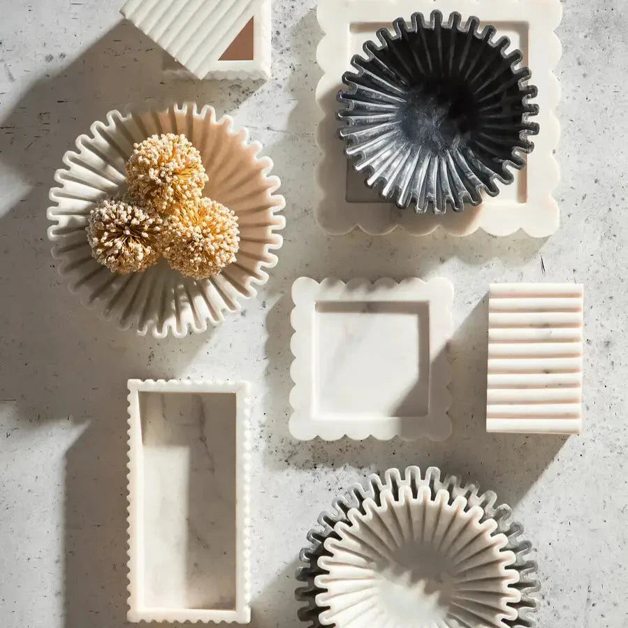 Natural white marble square lidded trinket box, scallop edge tray, and scalloped marble bowls. Available to purchase from Albury House Interiors.