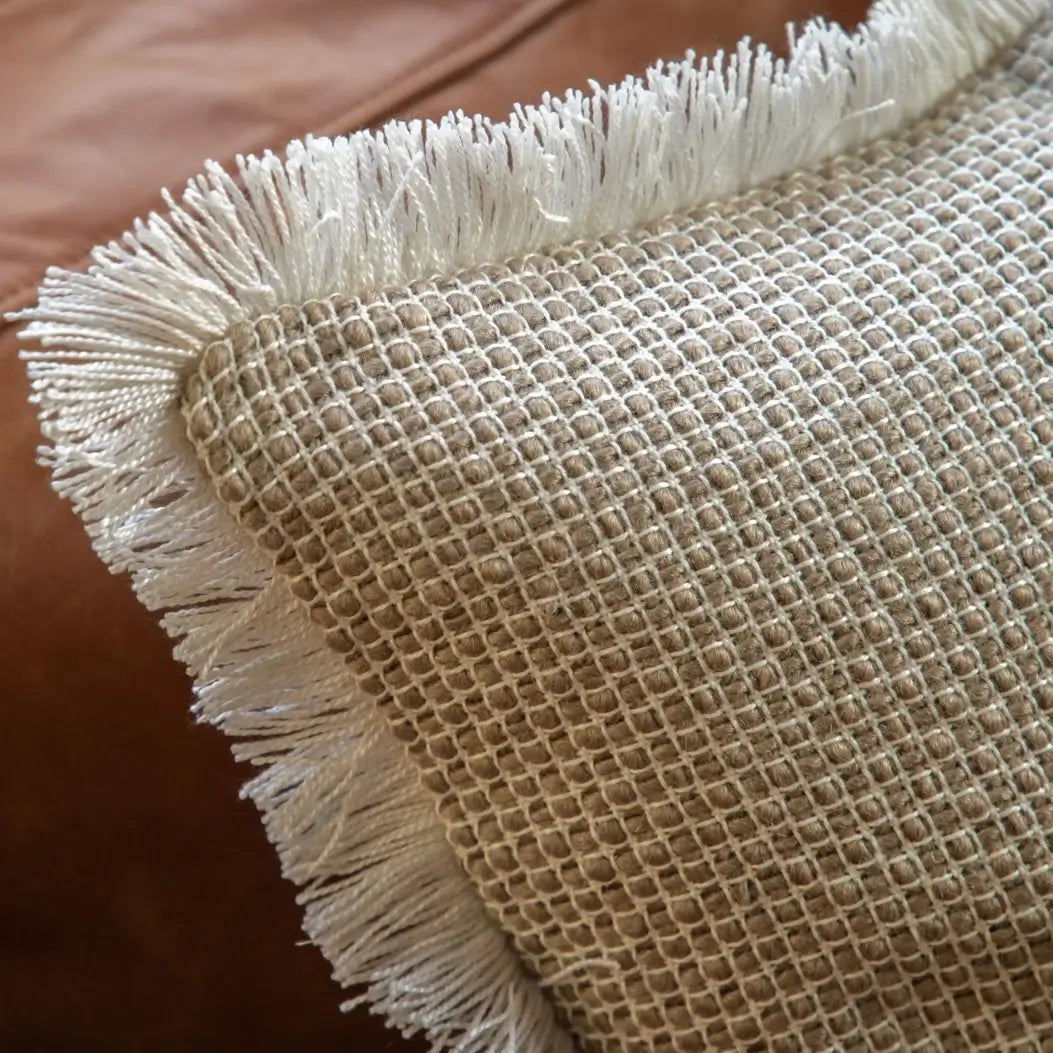 natural-woven-square-cushion-with-cream-neutral-fringed-tassle-edge-at-albury-house-interiors-essex