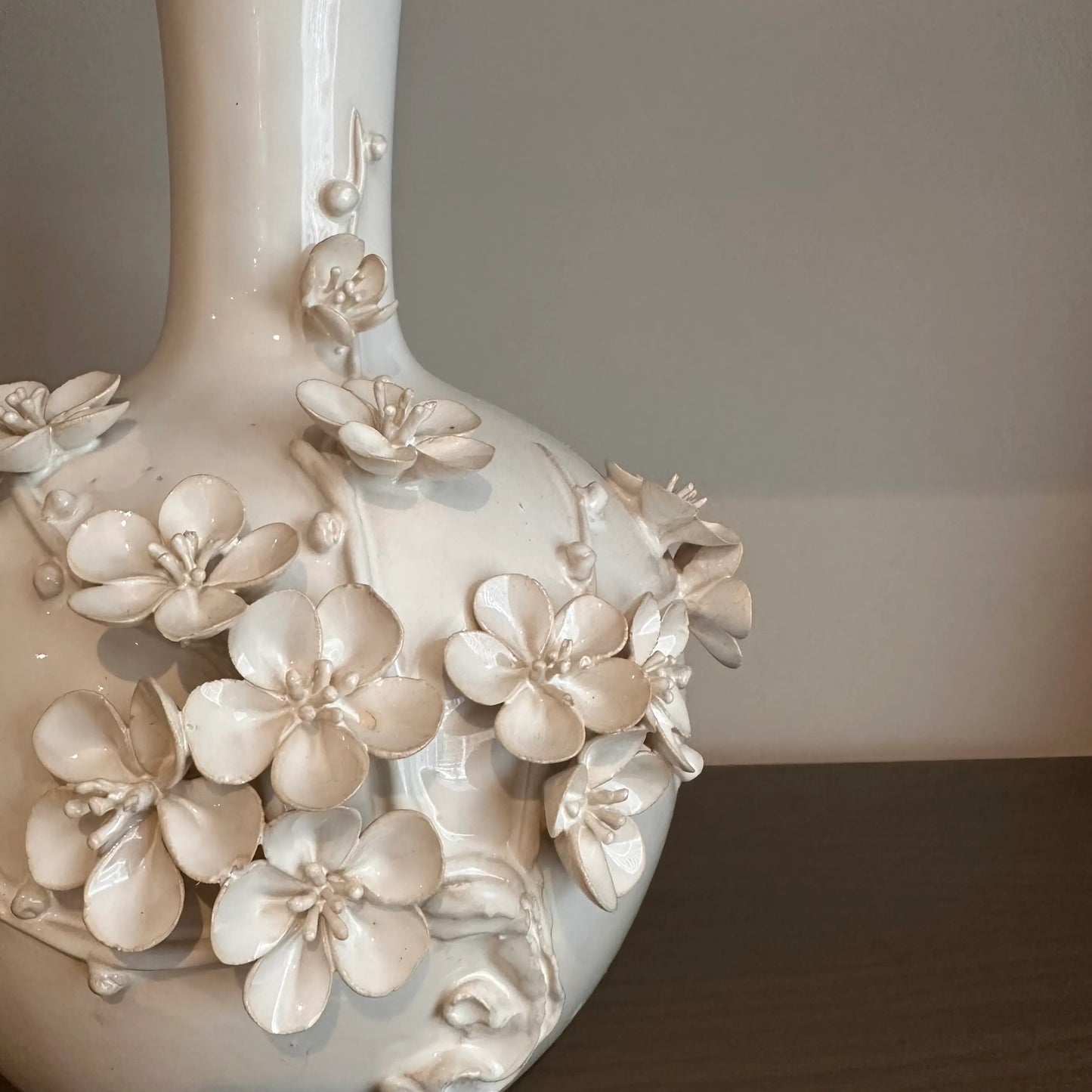 Cream Blossom Vase with beautiful 3D flowers across the face, in a wide bottle shape with slim neck. Available to purchase at Albury House Interiors.
