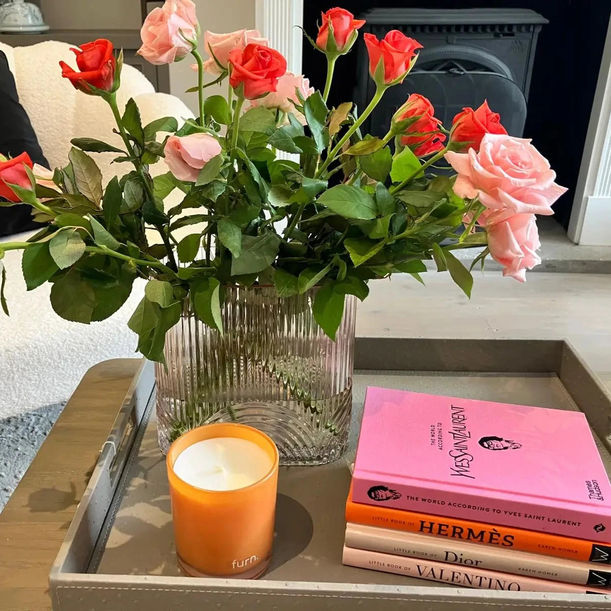 pink-ribbed-glass-vase-with-roses-on-faux-ostrich-leather-coffee-table-tray-with-designer-coffee-table-books-at-albury-house-interiors