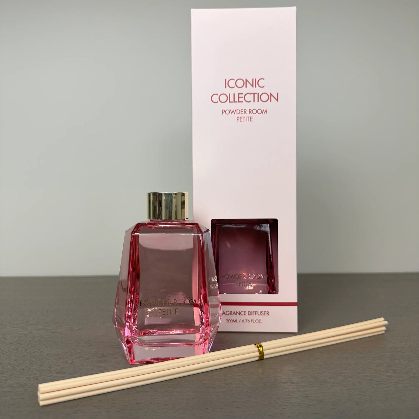 pink-glass-powder-room-reed-diffuser-with-rose-and-oud-scent-comes-gift-boxes-with-wooden-reeds-from-albury-house-interiors