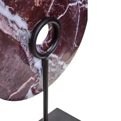red-veined-marble-disc-sculpture-on-black-iron-stand-at-albury-house-interiors-essex