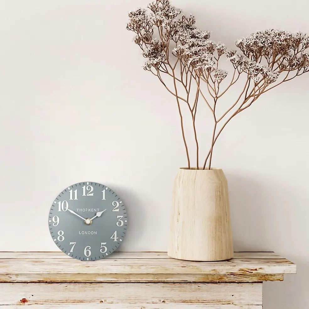 grey-circular-thomas-kent-pale-blue-battery-powered-mantel-clock-with-white-hands-and-numbers-at-albury-house-interiors-essex