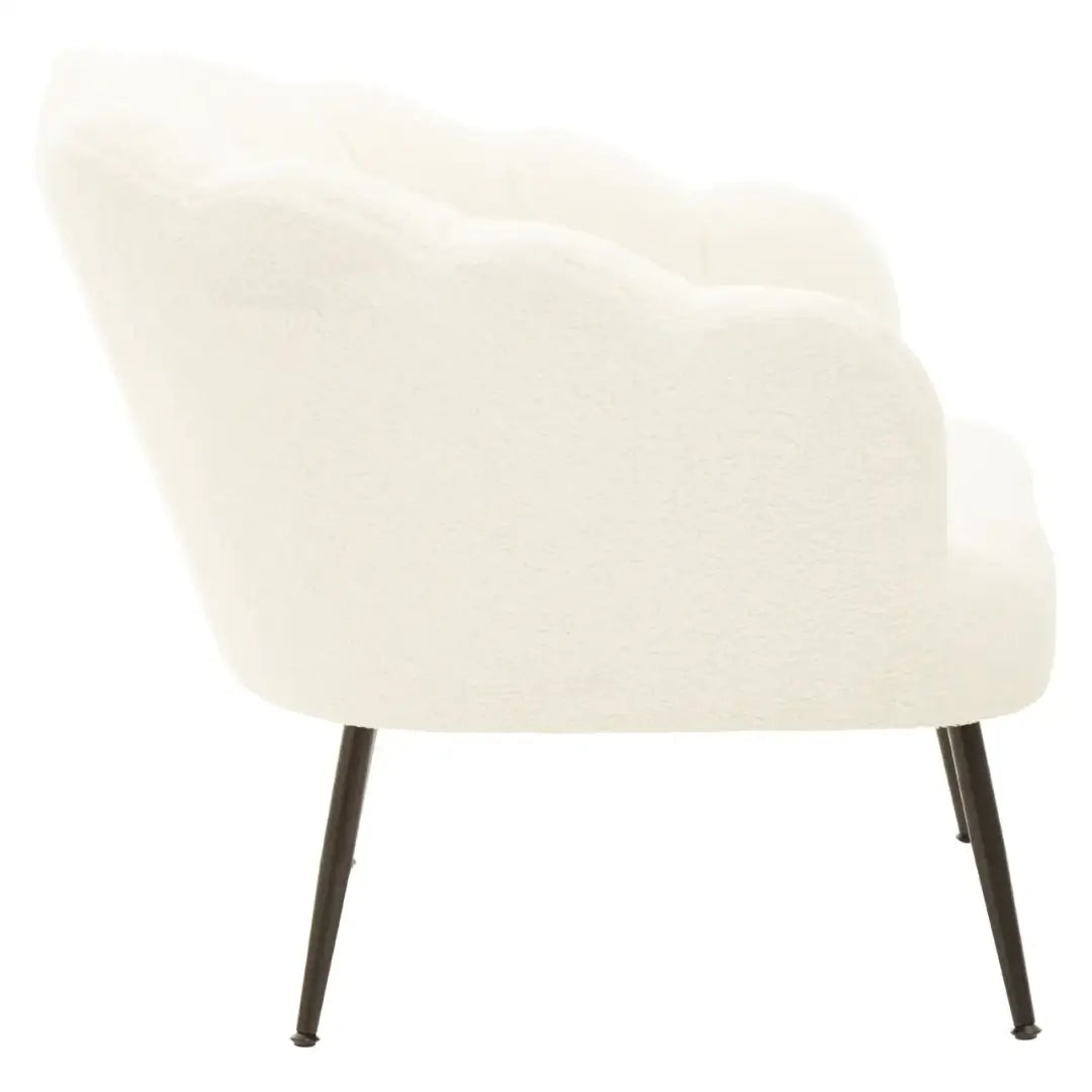 White soft boucle armchair occasion chair in a shell shape with scalloped edges and matte black legs, available to purchase from Albury House Interiors, Essex.