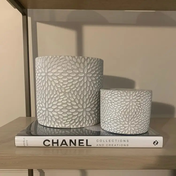 Small starburst flower pattern planter plant pot, crafted from cement finished with white detailing. Perfect for your houseplants or outdoor plants, available to purchase at Albury House Interiors.