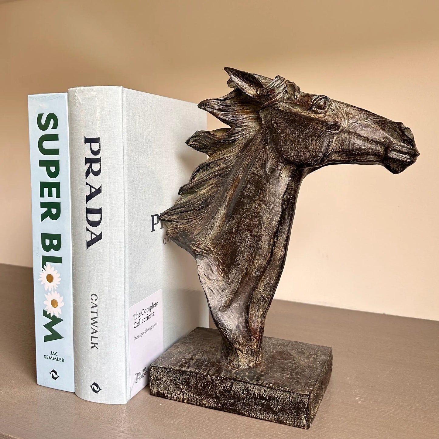 bronze-spirit-horses-head-sculpture-ornament-with -blue-superbloom-hardback-book-and-baby-blue-prada-catwalk-book-at-albury-house-interiors-essex