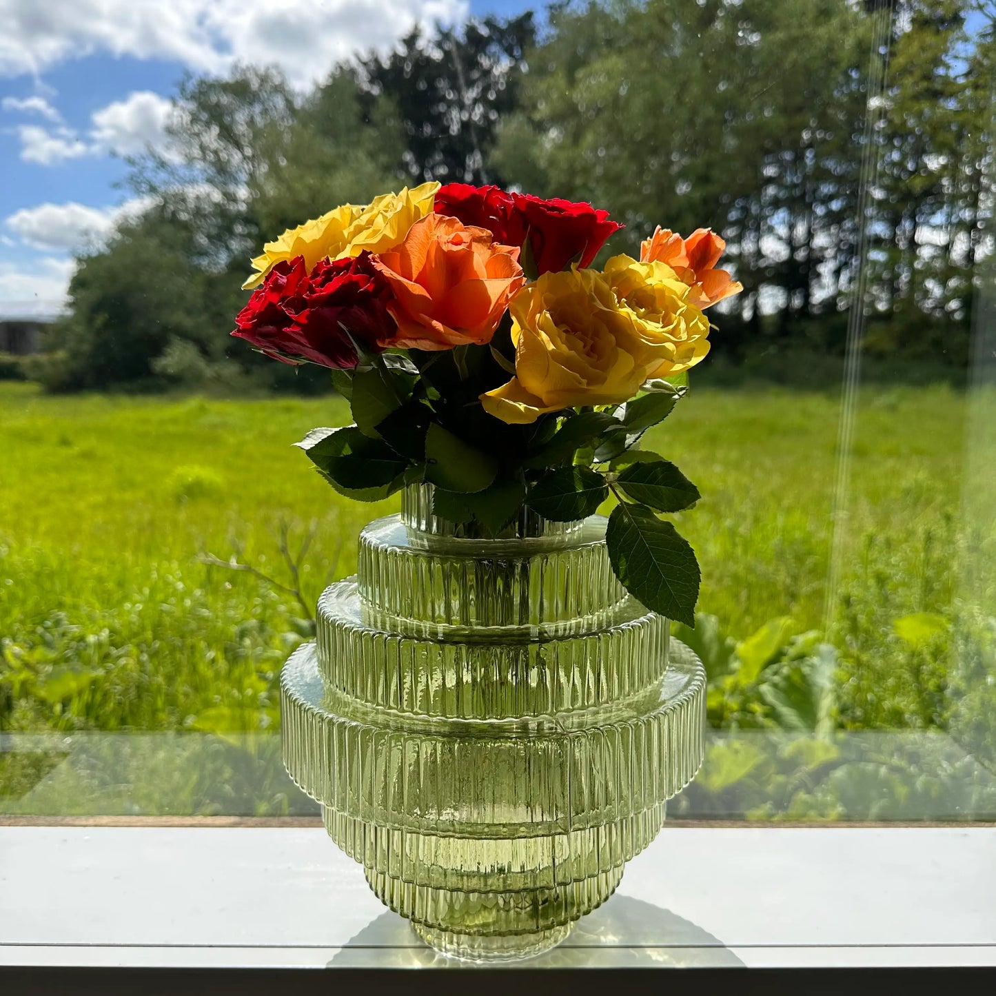 lime-green-glass-ribbed-vase-with-step-detail-and-fresh-cut-roses-at-albury-house-interiors