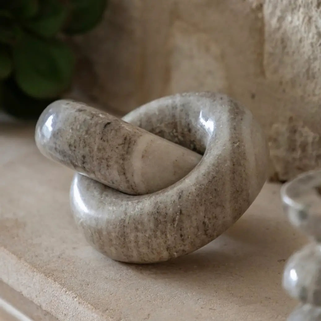 taupe-natural-veined-marble-chain-links-sculpture-at-albury-house-interiors-essex