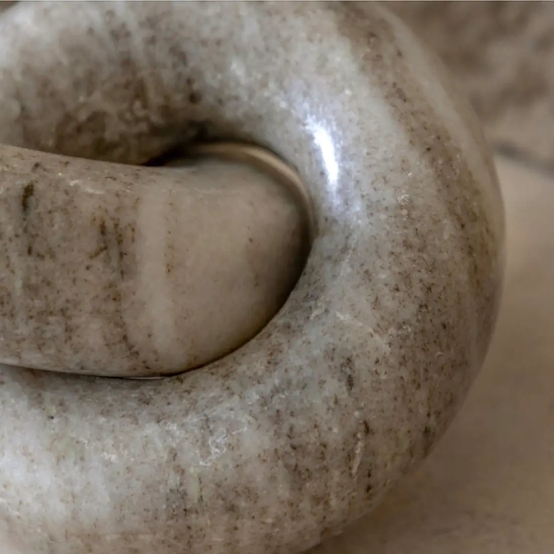taupe-natural-veined-marble-chain-links-sculpture-at-albury-house-interiors-essex