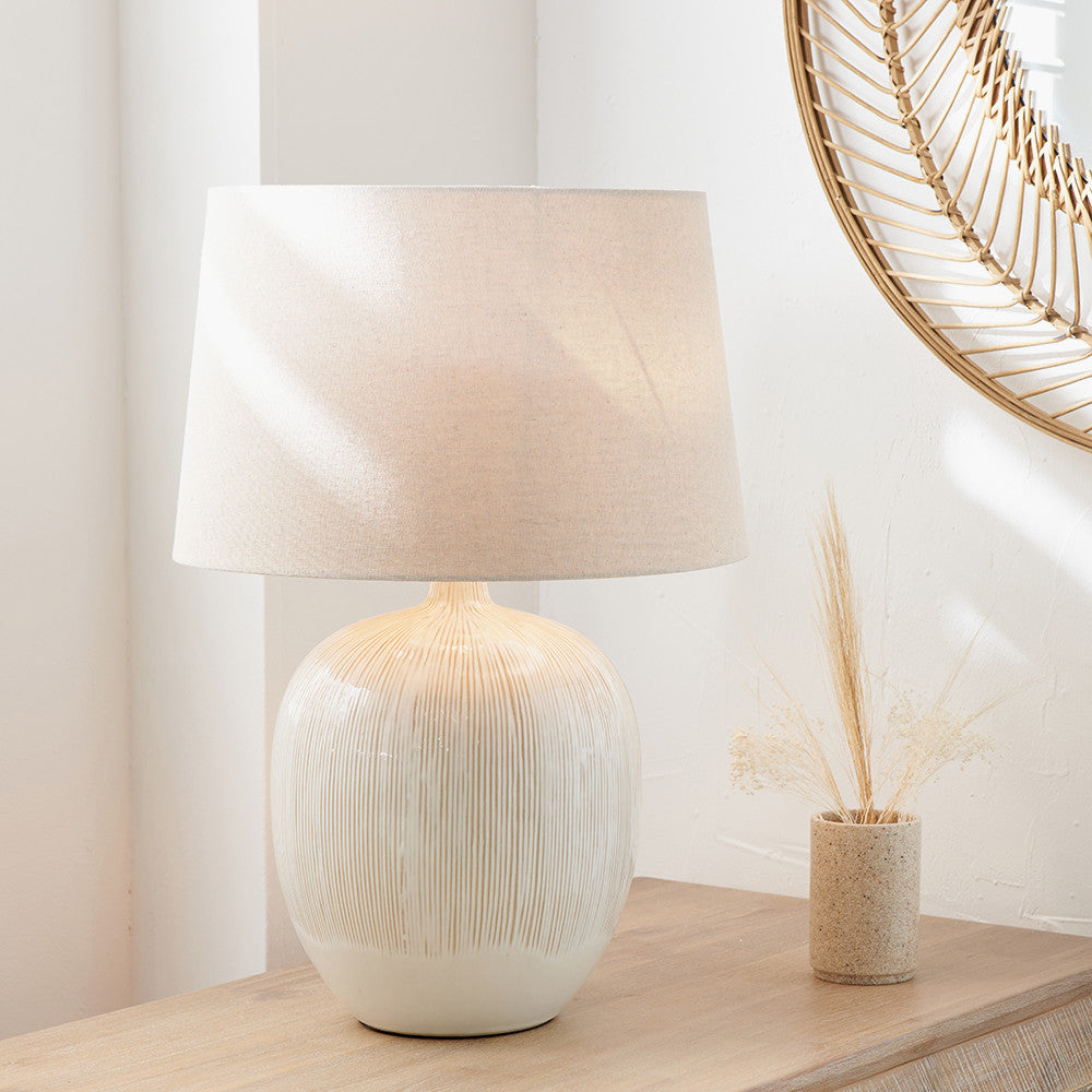 textured-neutral-table-lamp-wth-line-detail-and-natural-linen-shade-at-albury-house-interiors