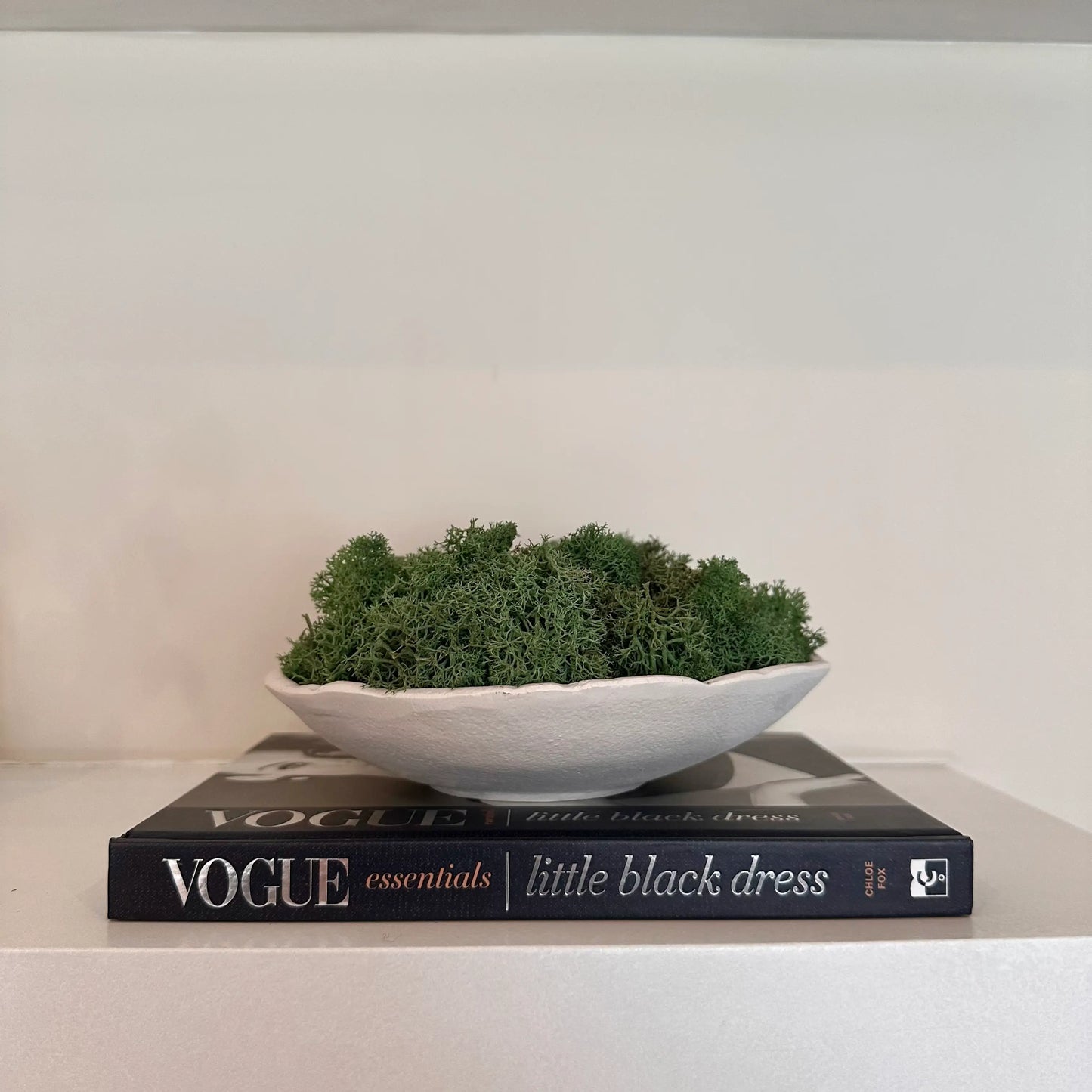 vogue-essentials-little-black-dress-hardback-coffee-table-book-in-navy-with-a-black-and-white-photo-on-the-front-of-a-model-wearing-a-little-black-dress-at-albury-house-interiors