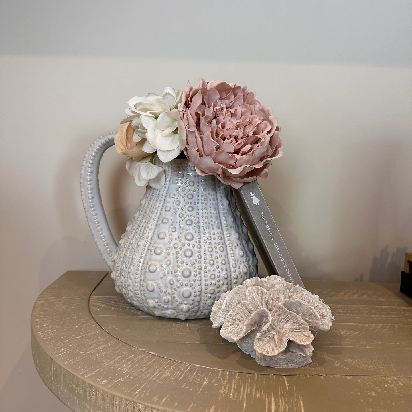 white-ceramic-dimple-texture-urchin-jug-vase-with-faux-flowers-and-faux-coral-with-handle-at-albury-house-interiors
