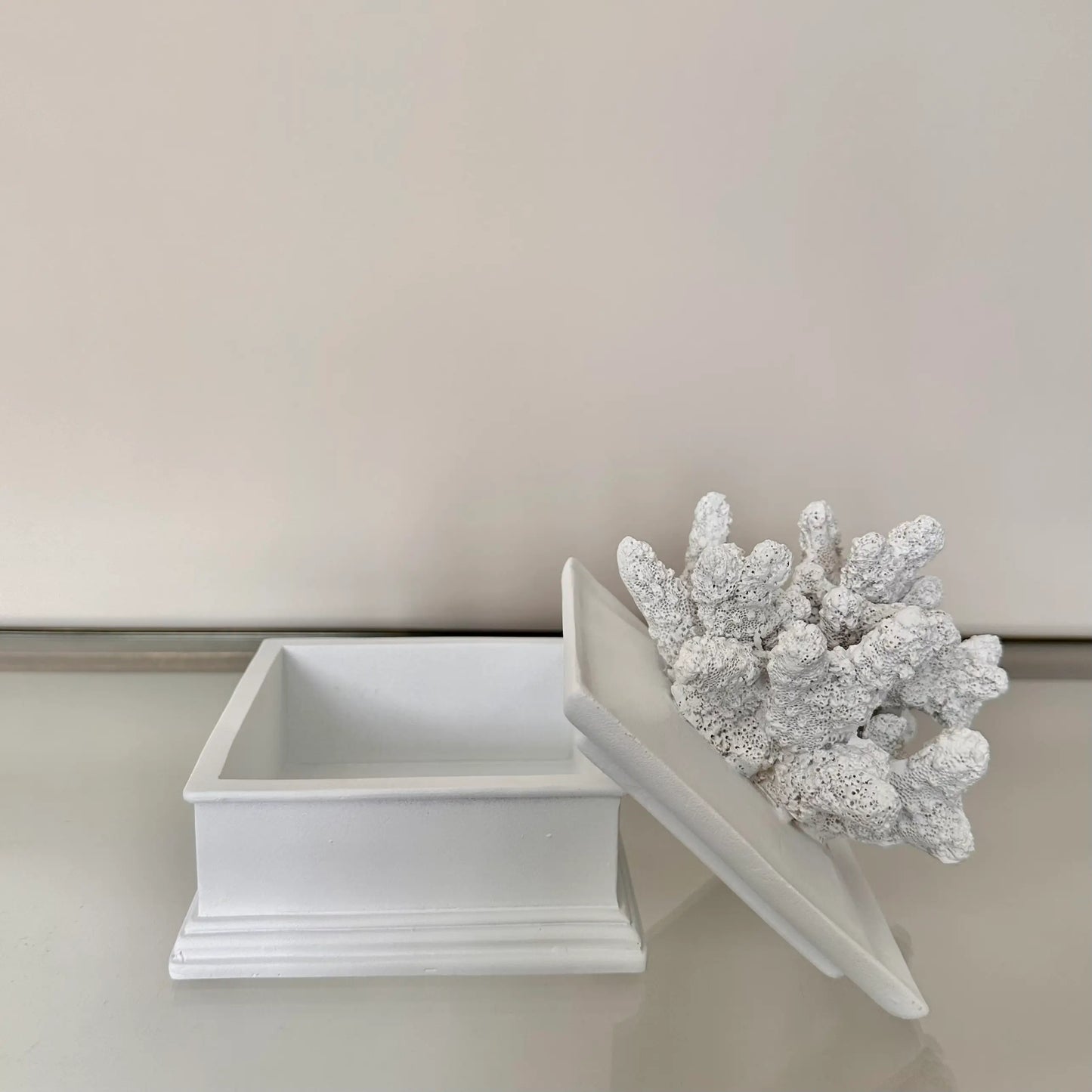 White lidded trinket box with beautiful faux coral placed on top, perfect for bedrooms and bathrooms, available to purchase at Albury House Interiors. Luxury homewares in the UK.