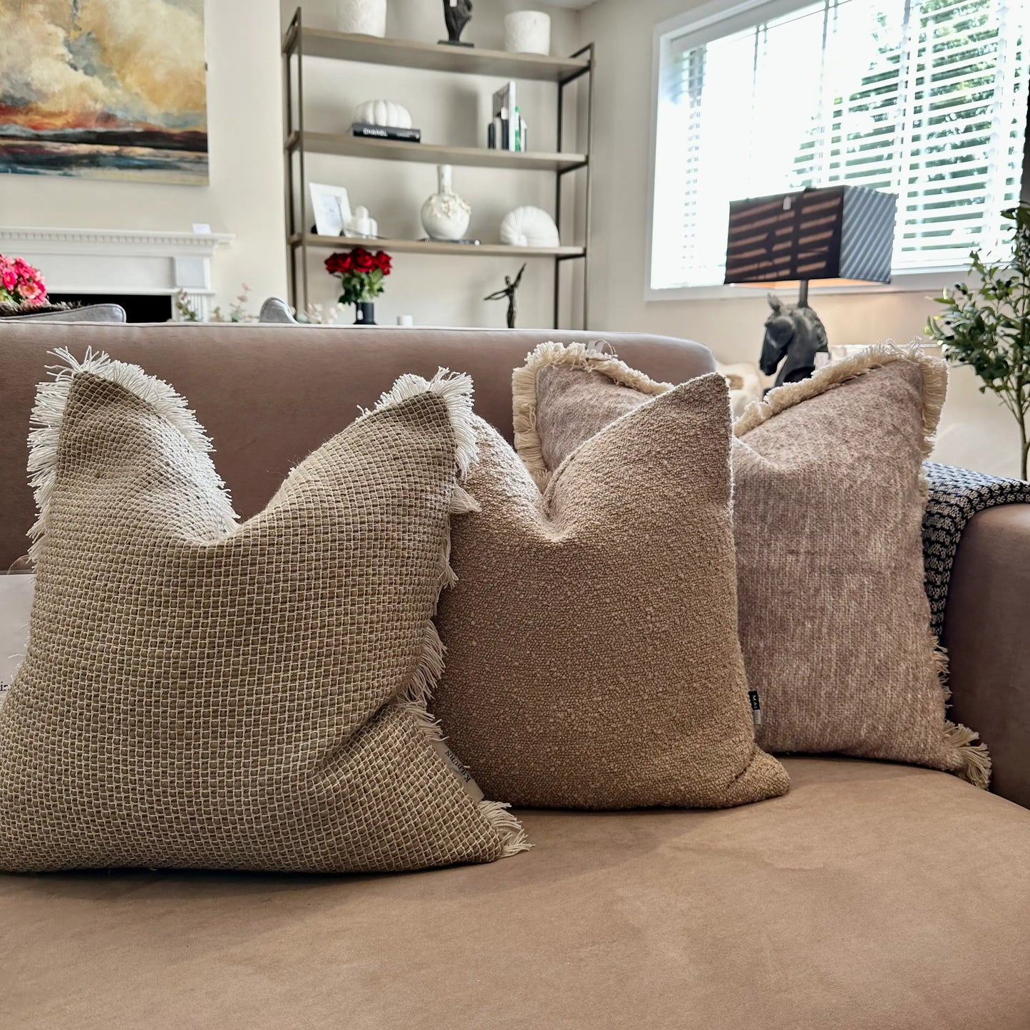 neutral-woven-fringed-cushion-taupe-boucle-cushion-and-boucle-fringed-tassled-cushion-at-albury-house-interiors-essex