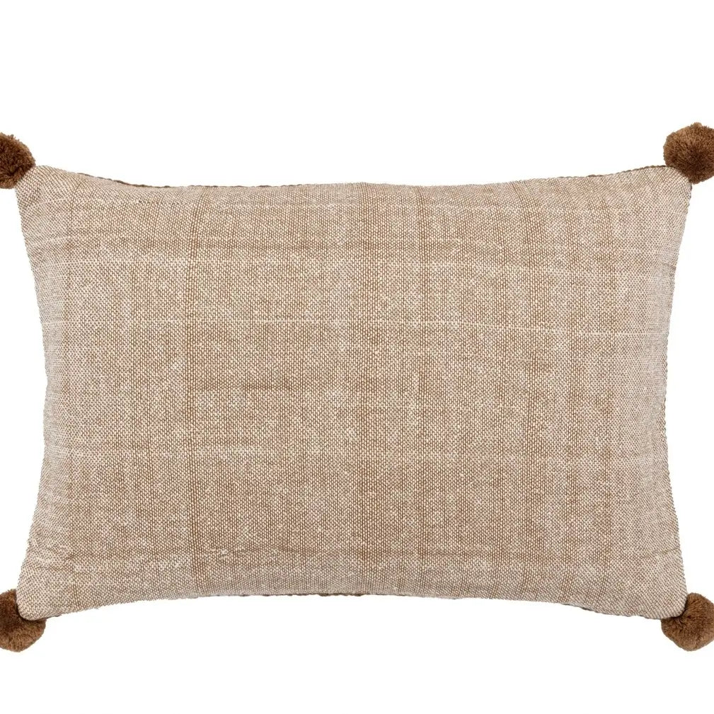 brown-knit-crochet-effect-rectangular-cushion-with-brown-pompoms-on-corners-and-neutral-colour-reverse-side-at-albury-house-interiors-essex