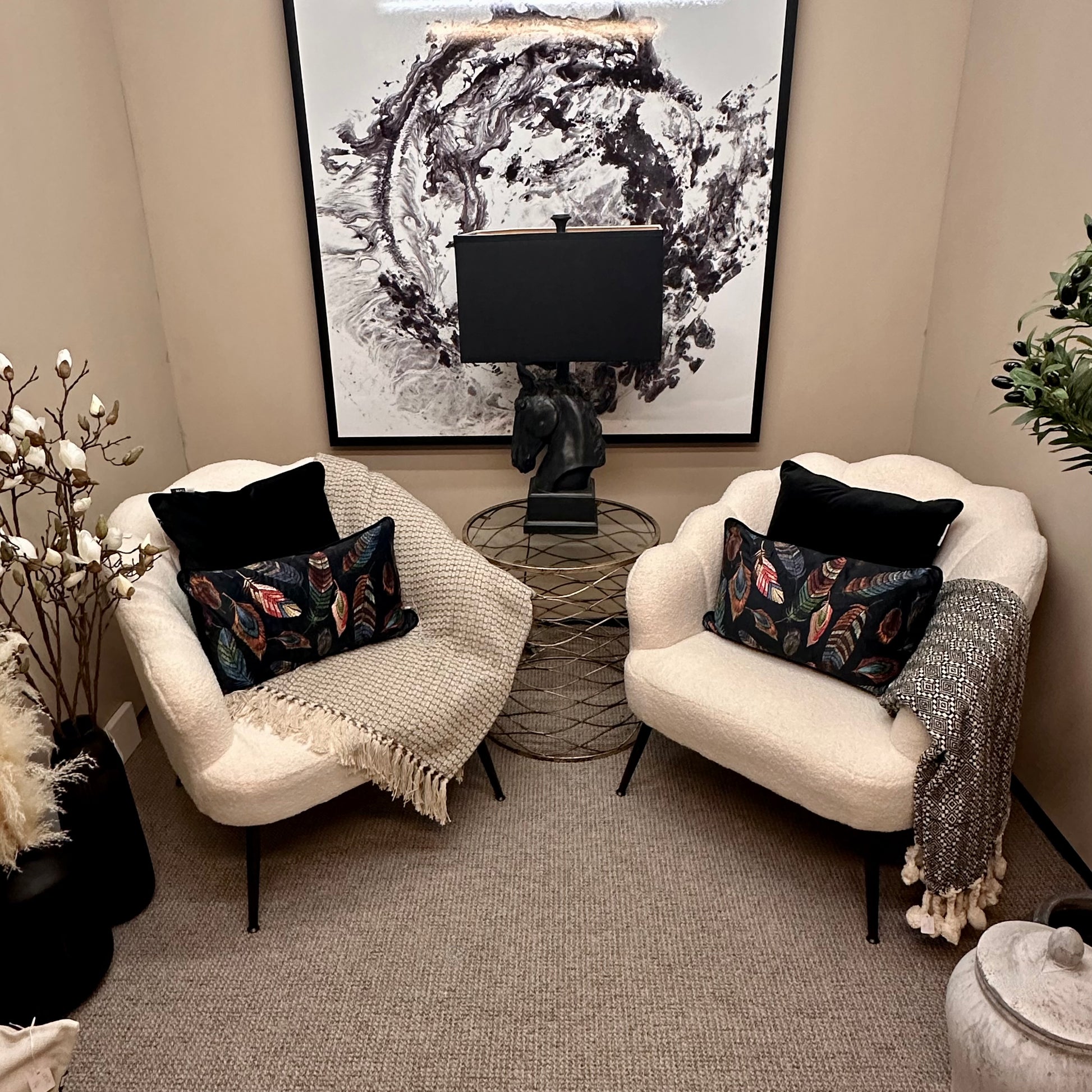 albury-house-interiors-boucle-chairs-black-feather-cushions-monochrome-setting 