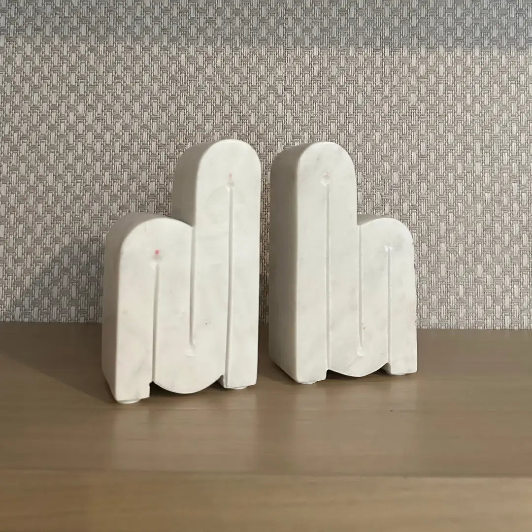 albury-house-interiors-white-curved-marble-bookend-set-on-bookcase