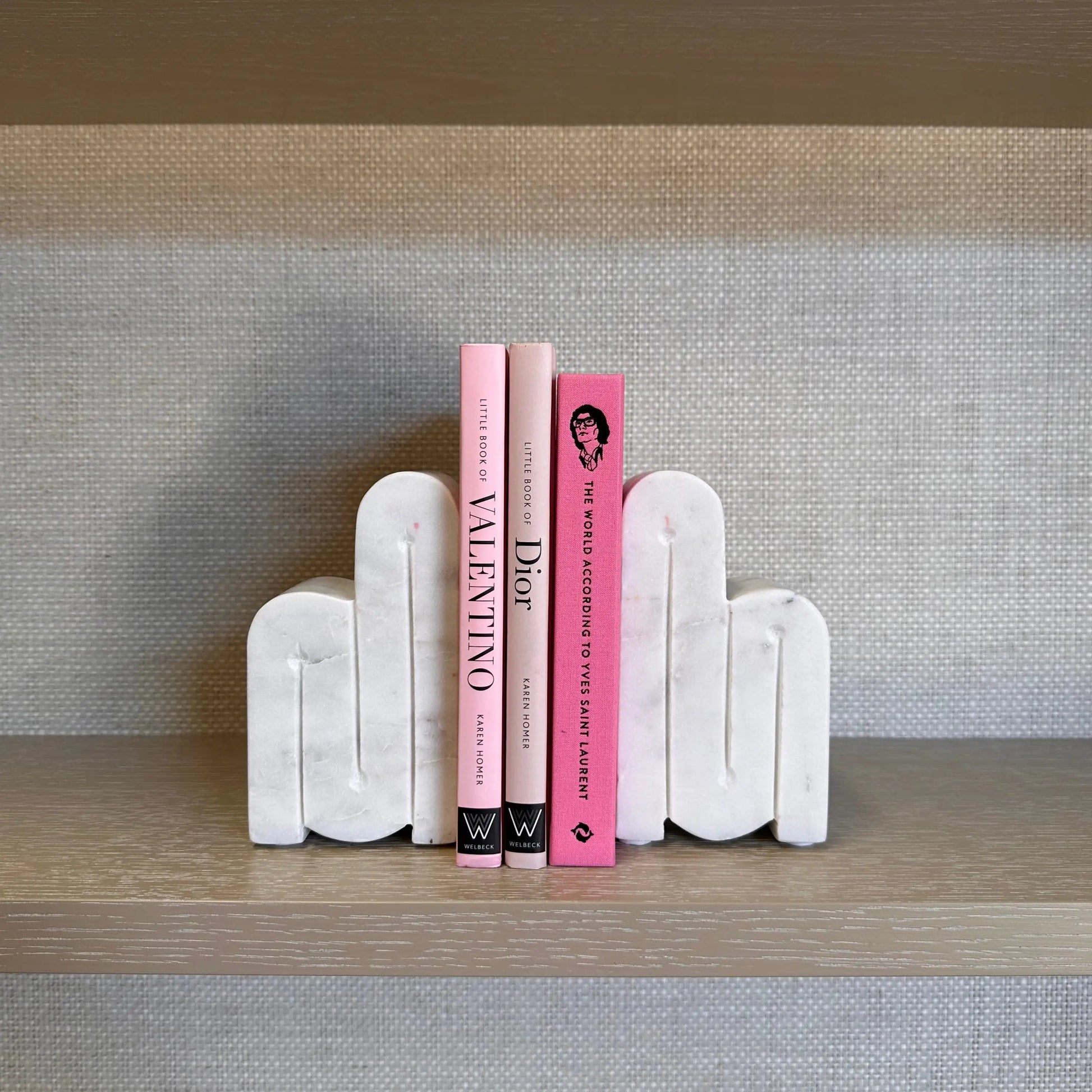 albury-house-interiors-white-curved-marble-bookend-set-with-pink-designer-books