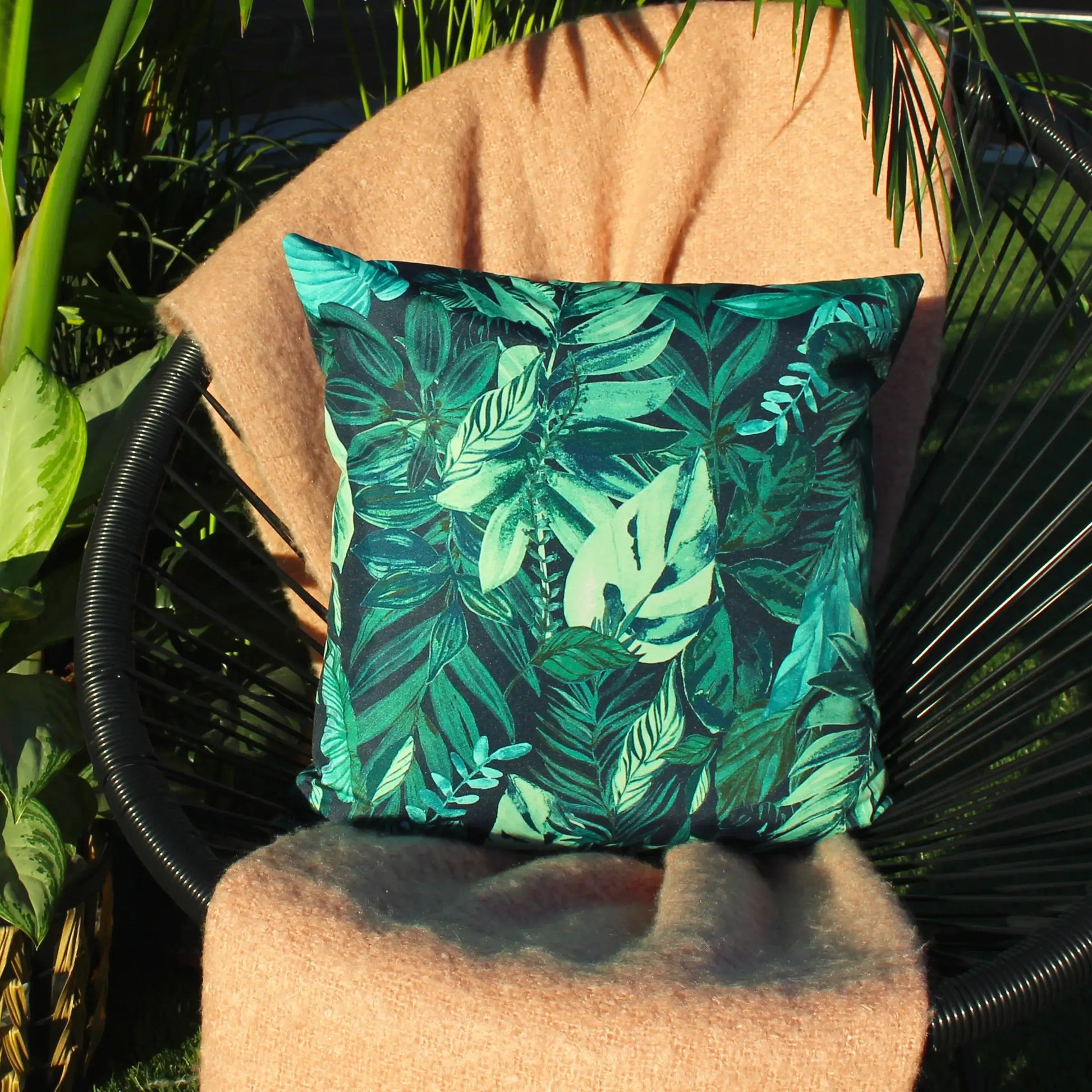 amazon-green-jungle-leaves-outdoor-garden-cushion-waterproof-uv-resistant-at-albury-house-interiors-shop-in-essex