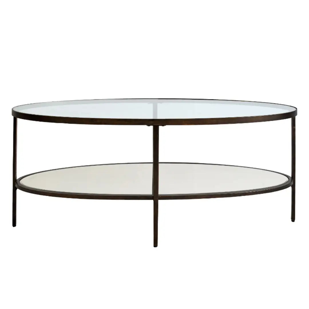Antique bronze finish curved oval shape coffee table with glass top and mirrored bottom shelf, available at Albury House Interiors.