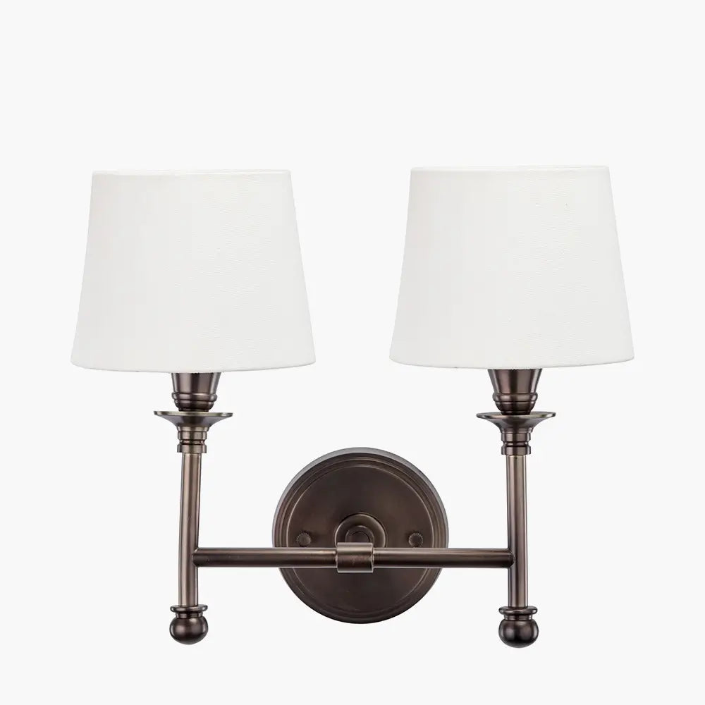 dark-antique-bronze-double-sconce-wall-light-with-white-cotton-shades-at-albury-house-interiors