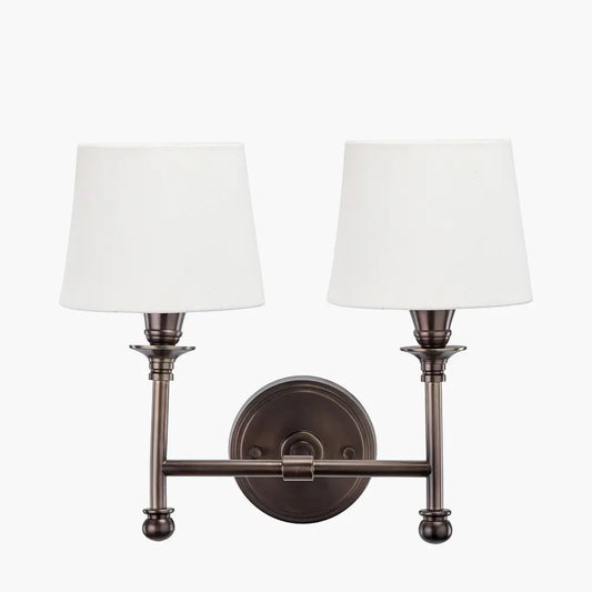 dark-antique-bronze-double-sconce-wall-light-with-white-cotton-shades-at-albury-house-interiors