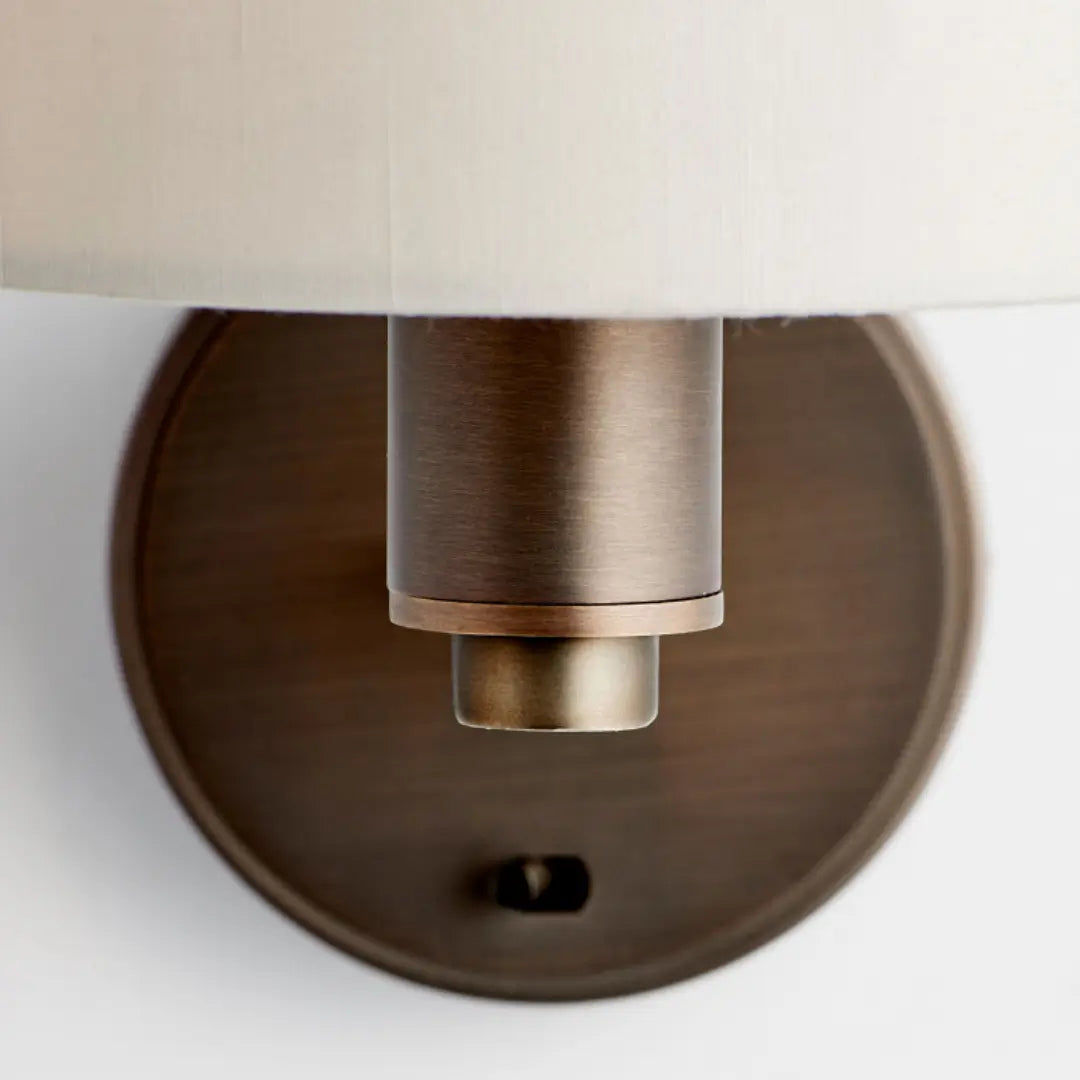 Trevi antique brushed bronze wall light sconce, with white marble faux silk shade and on/off switch. Available to purchase from Albury House Interiors, with matching ceiling lights available.