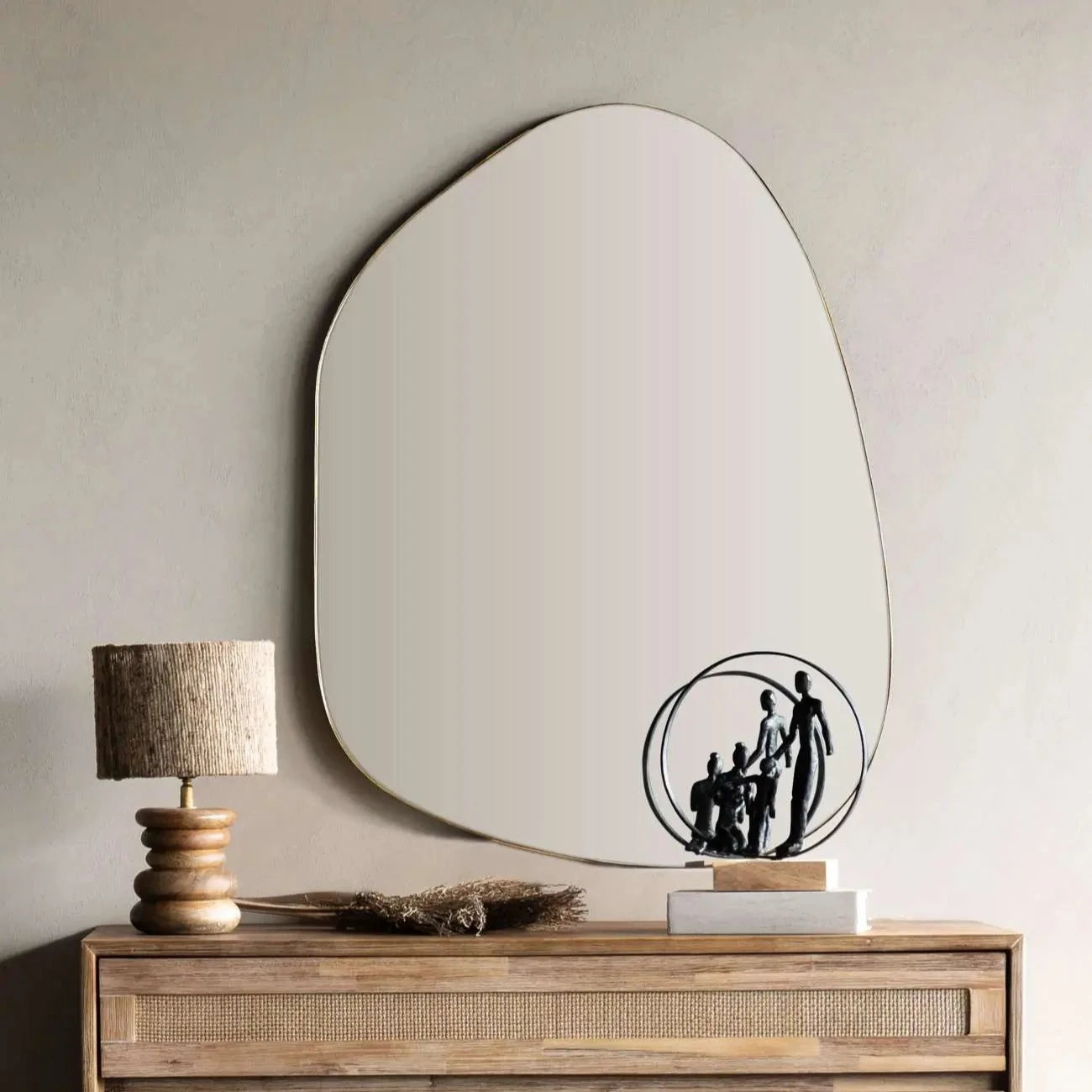 ashton-bronze-abstract-shape-wall-mirror-above-sideboard-at-albury-house-interiors