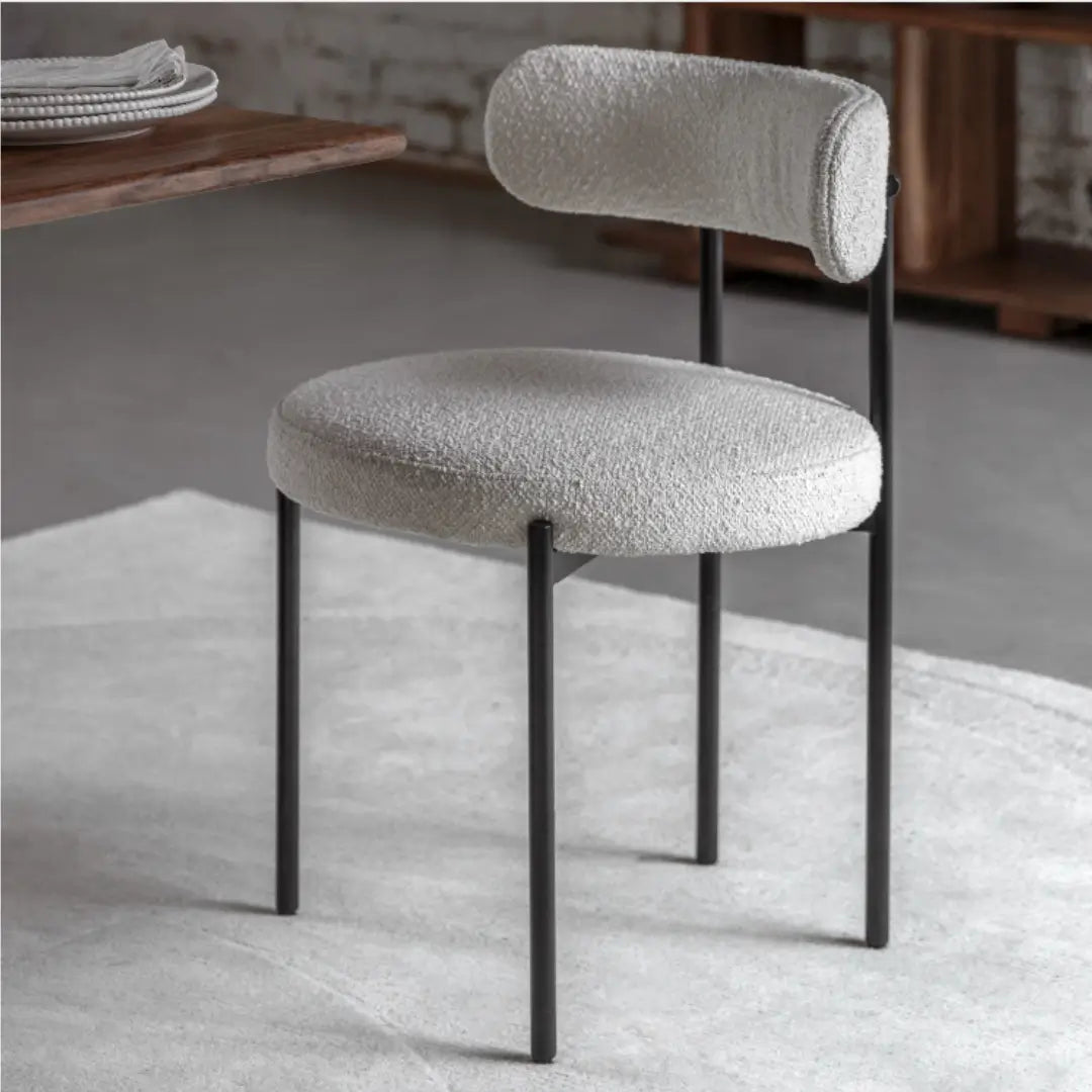 pair-of-ava-boucle-style-chairs-with-black-frames-and-curved-backrests-at-albury-house-interiors