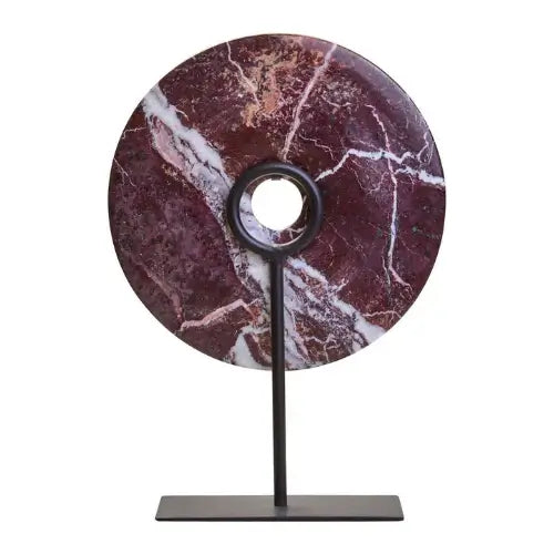 natural-red-and-white-veined-marble-disc-sculpture-on-matt-black-stand-at-albury-house-interiors-as-used-by-interior-designers