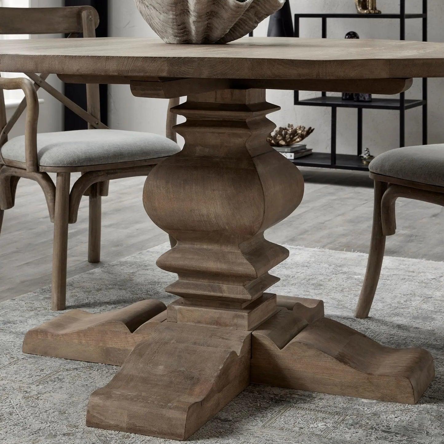 Wardour round solid wood dining table with intricate detailed base. Available to purchase at Albury House Interiors.