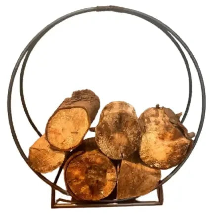 circle shaped black metal firewood holder with logs at albury house interiors 