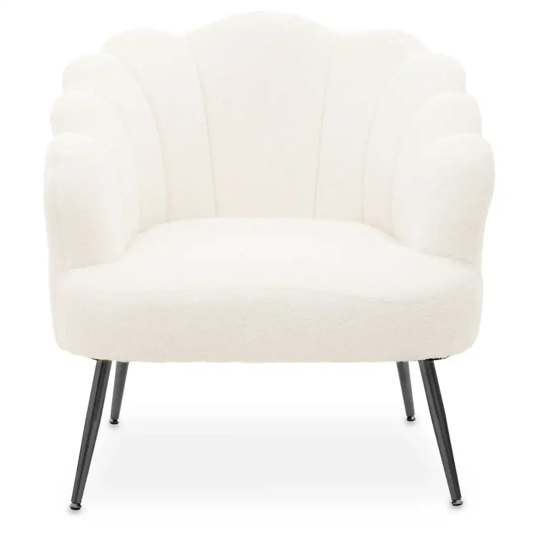 White soft boucle armchair occasion chair in a shell shape with scalloped edges and matte black legs, available to purchase from Albury House Interiors, Essex. 