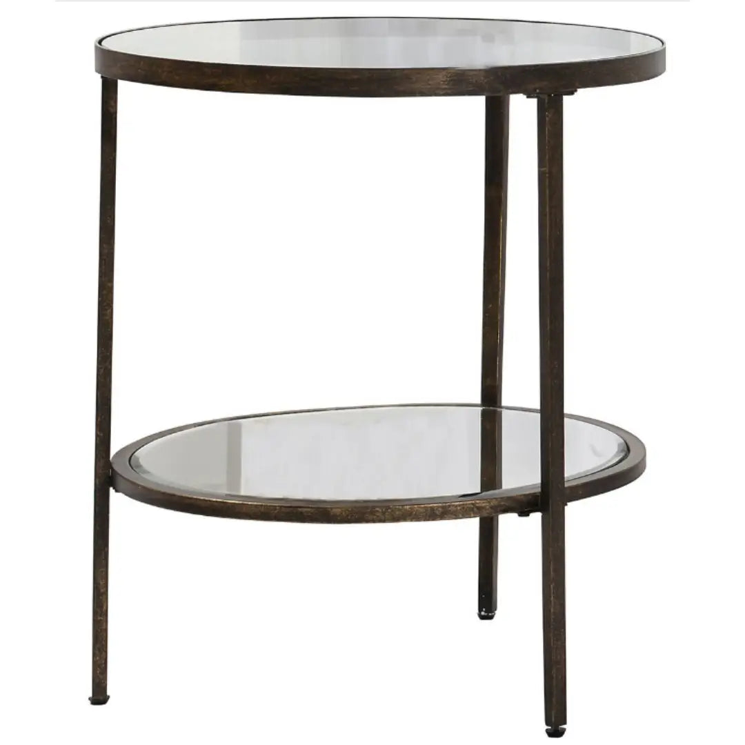Antique bronze round side table with glass top and mirrored shelf. Perfect for use in bedrooms, living rooms, dining rooms and hallways. Available to purchase from Albury House Interiors, homewares and free standing furniture in the UK.