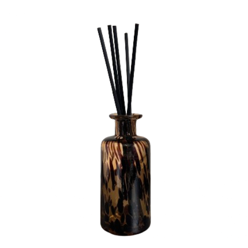 large-brown-speckled-mottled-glass-diffusr-with-black-reed-sticks-and-balsam-forest-scent-at-albury-house-interiors