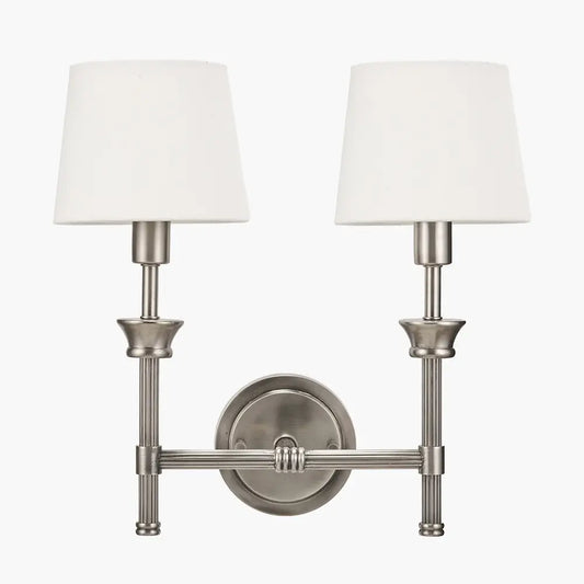 brushed-silver-cast-brass-double-wall-light-with-white-cottom-shades-in-living-room-with-soft-ighting-at-albury-house-interiors