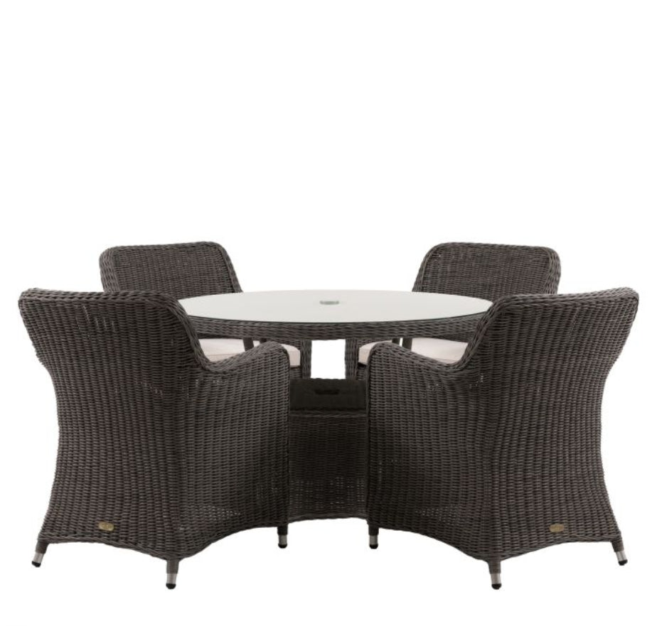 A 5-piece outdoor dining set featuring a round glass-top table and four high-back woven wicker chairs with white seat cushions, shown against a plain white background available at Albury House Interiors.