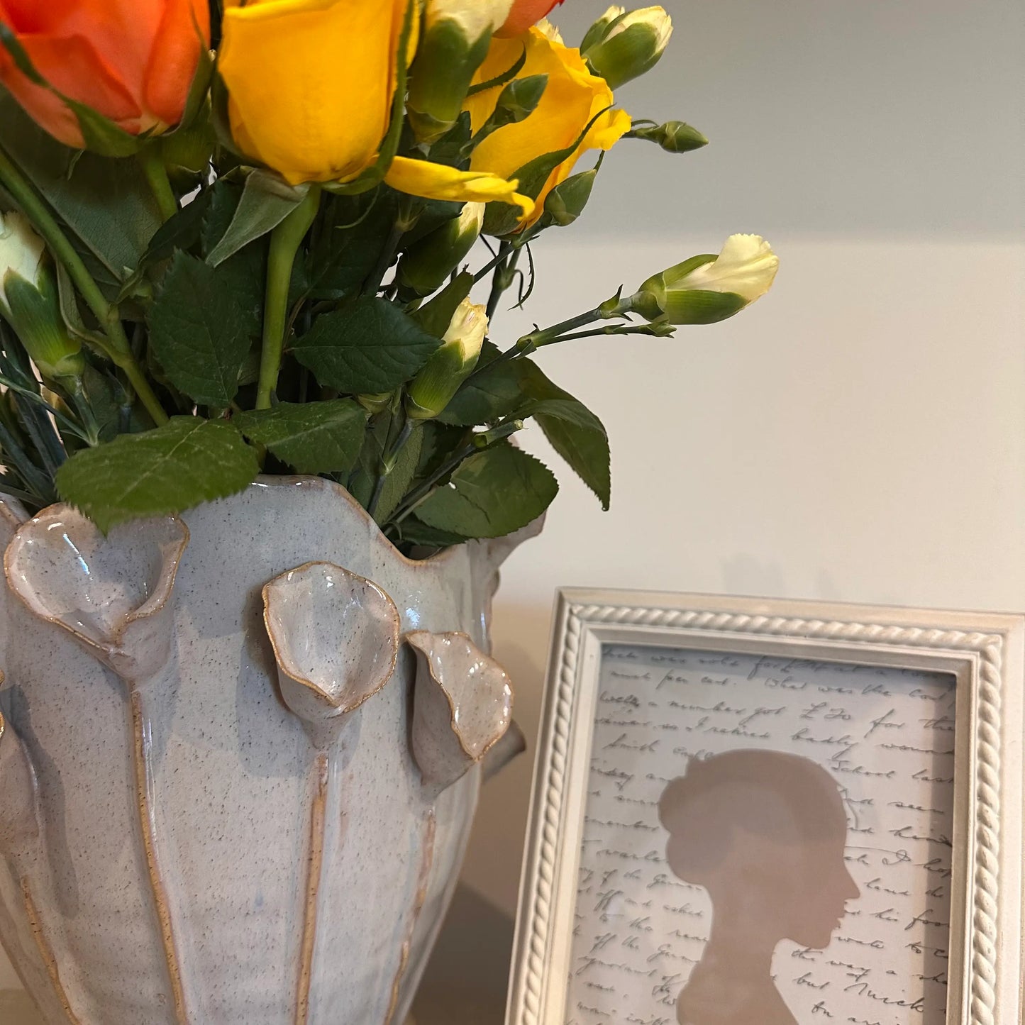 ceramic-lilac-calla-lily-vase-with-beaded-neutral-coloured-photoframe-at-albury-house-interiors-essex